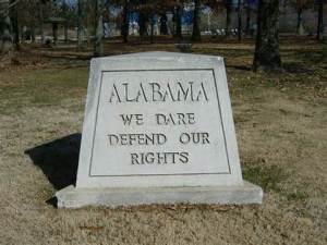 Alabama state motto.  (Yeah, I bet you thought it was "Roll Tide".)